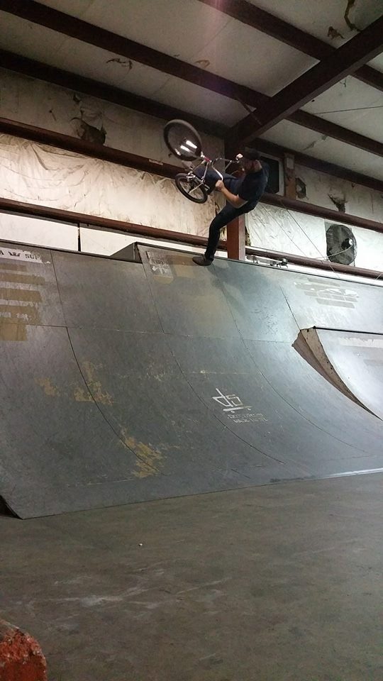 Matt Stahl planting a foot and tweaking his 22" holmes above his head.